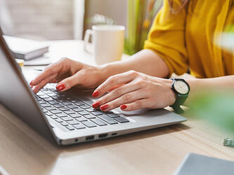 woman using laptop at desk